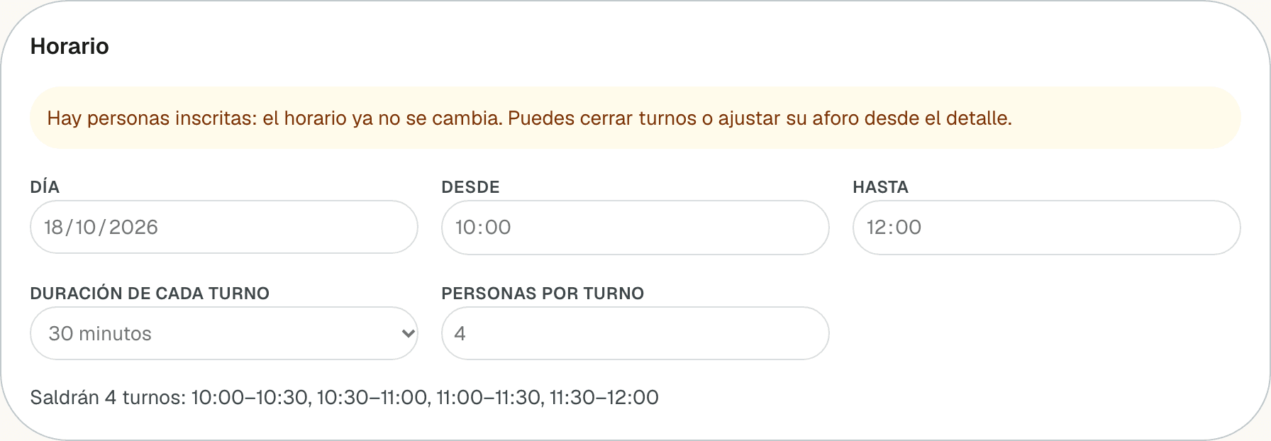 Sección Horario del editor con el aviso de que hay personas inscritas y los campos bloqueados